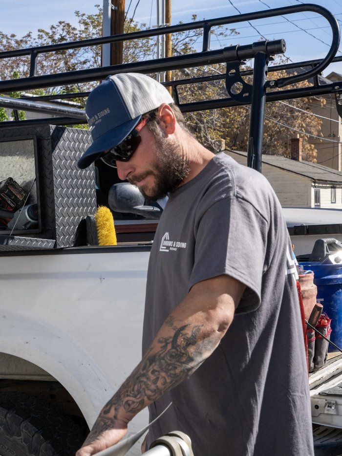 Renovations INC team member with the branded service truck — local Nevada-licensed contractor